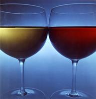 Two wine glasses on blue