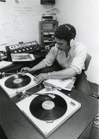 Student DJ in the WIIT studio, Illinois Institute of Technology, Chicago, Illinois, ca. 1980s