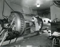 Professor W. Rudolph Kanne with his electrostatic generator (atom smasher), Illinois Institute of Technology, Chicago, Illinois, ca. 1941