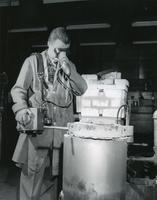 Armour Research Foundation ceramics engineer using optical pyrometer, Illinois Institute of Technology, Chicago, Illinois, ca. 1940s