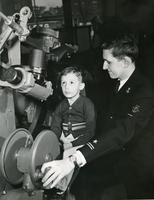 NROTC member with boy, Illinois Institute of Technology, Chicago, Illinois, 1949