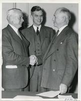 James Cunningham, Henry  Heald, and Alex Bailey after signing the merger agreement between Armour Institute and Lewis Institute, Chicago, Illinois, October, 1939