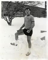 Unidentified student wearing shorts and a t-shirt in the snow, Illinois Institute of Technology, Chicago, Illinois, ca. 1980