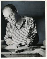 Jack Waldheim working on a woodcut with a circular saw, Chicago School of Design/Institute of Design, Chicago, Illinois, ca. early 1940s