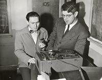 Unknown Illinois Institute of Technology student and instructor with a wire recorder used in a public speaking class, Chicago, Illinois, ca. 1947-1950