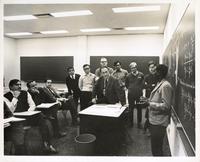 Civil Engineering professor Eben Vey with students in classroom, Illinois Institute of Technology, Chicago, Illinois, ca. 1960s