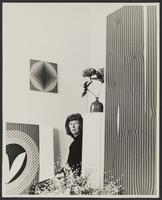 Mary Henry surrounded by her paintings, Mendocino, California, 1966