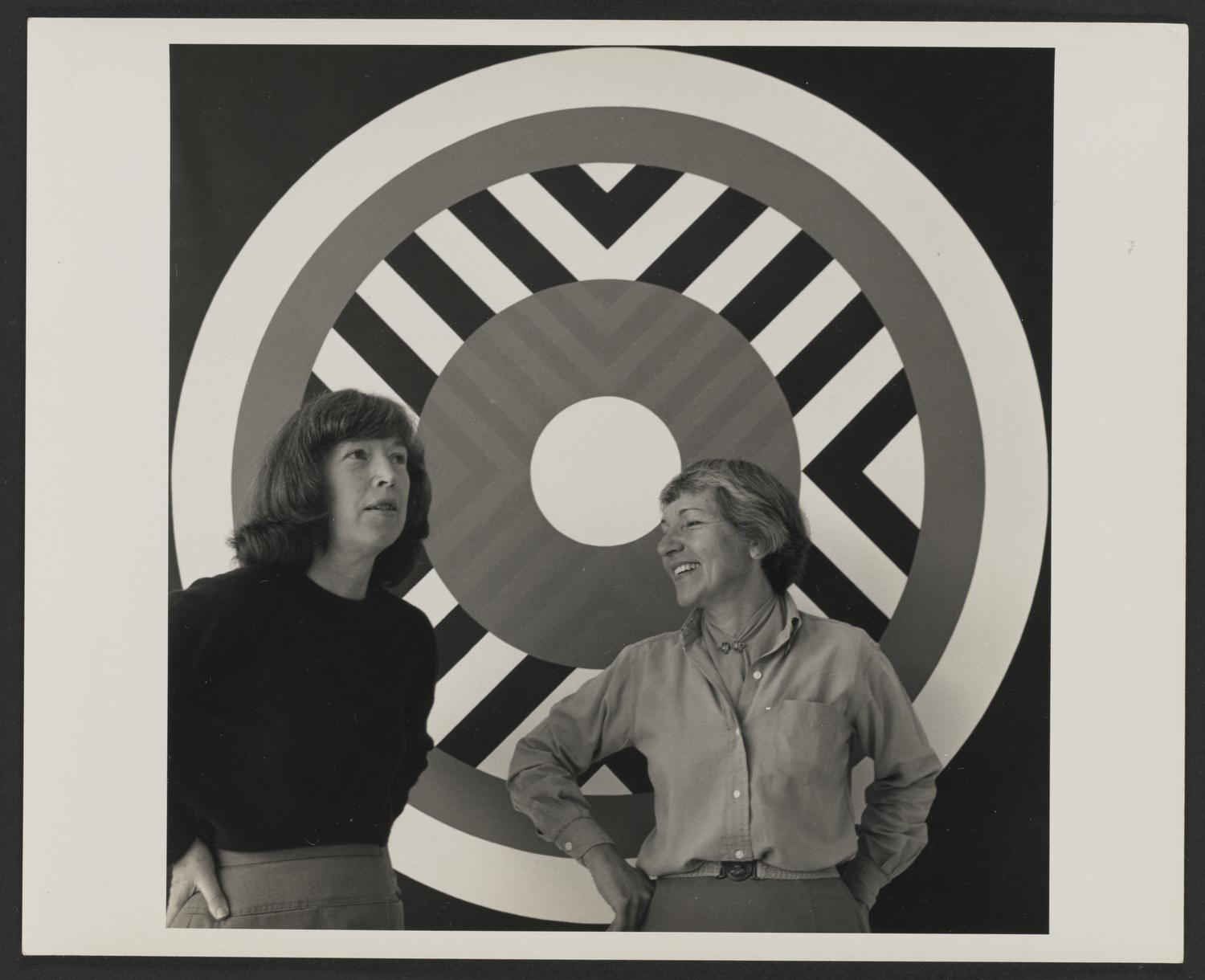 Mary Henry and Estelle Grunewald in front of one of Henry&#39;s paintings, ca. 1966-1967