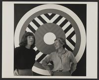 Mary Henry and Estelle Grunewald in front of one of Henry's paintings, ca. 1966-1967